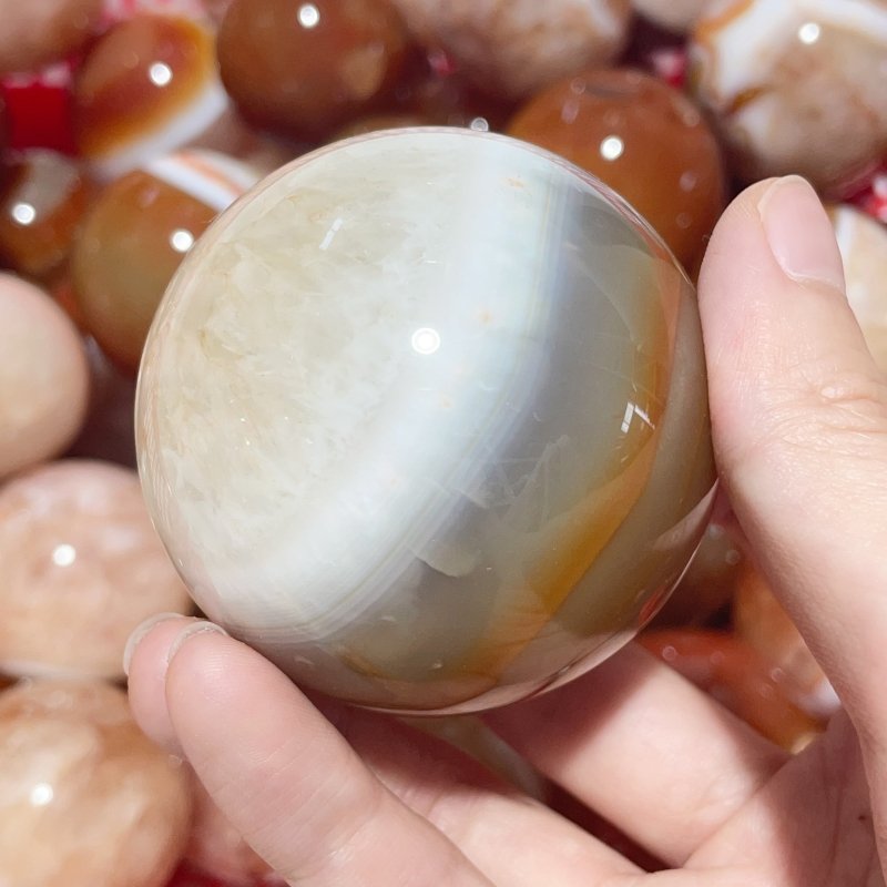 1.5 - 2.7in Carnelian Mixed Quartz Stripe Spheres Wholesale - Wholesale Crystals