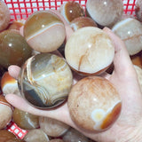 1.5 - 2.7in Carnelian Mixed Quartz Stripe Spheres Wholesale - Wholesale Crystals