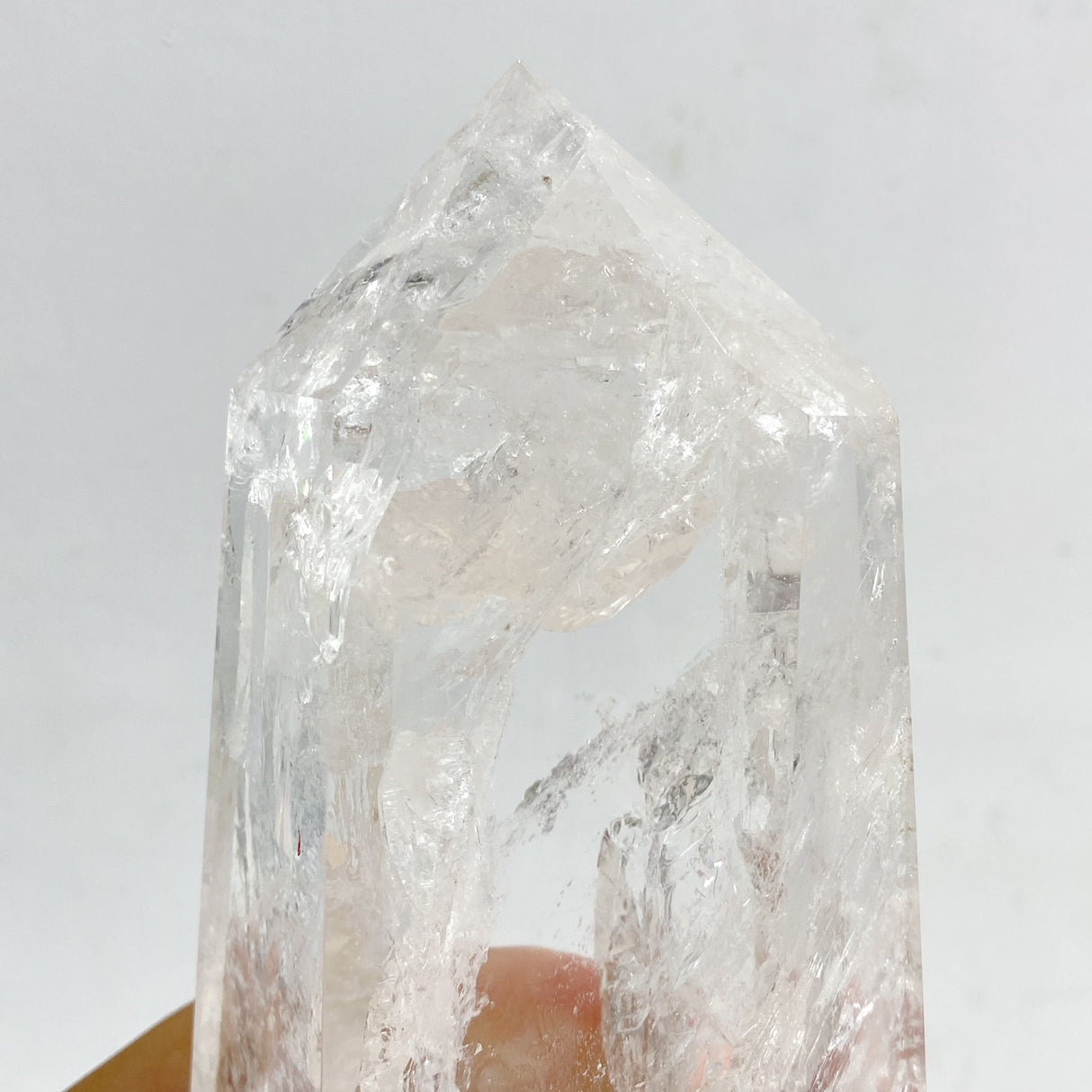 Clear Quartz Point Raw Bottom With Stand